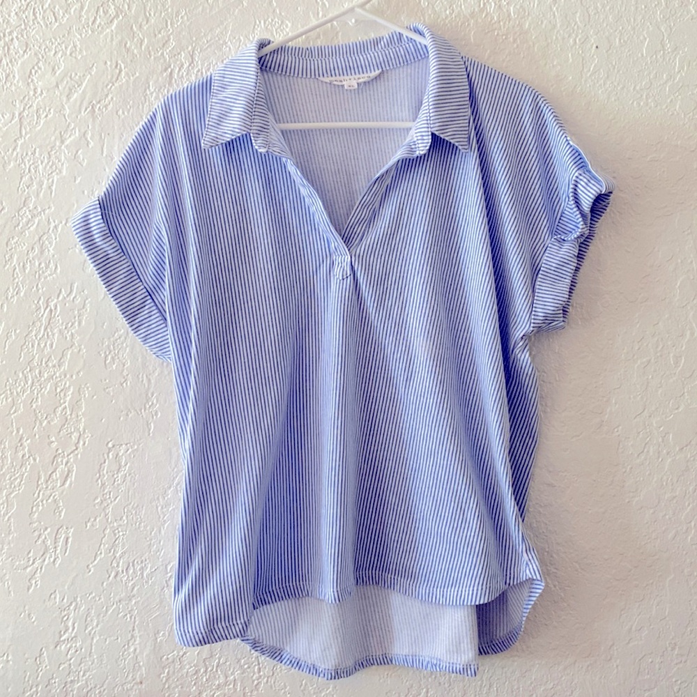 Casual blue and white striped top with button pinned cuff.